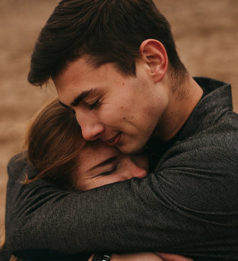 Two people in a close hug